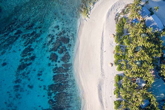 namotu-island-aerial-shot-of-white-sand-beach-and-palm-trees