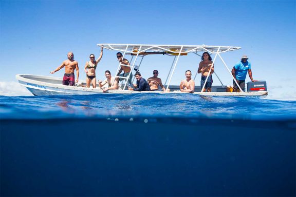 surfers-on-boat-namotu-island