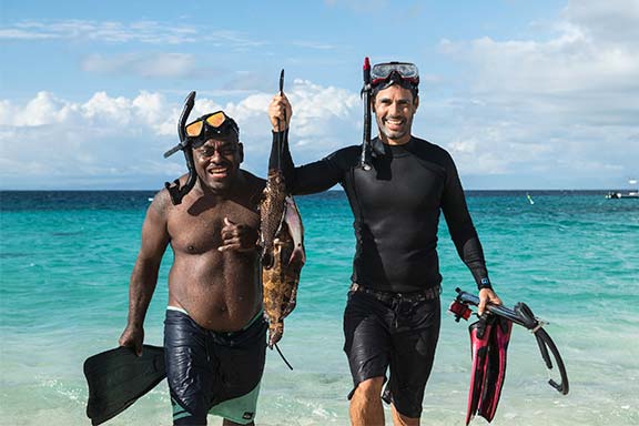 two-spear-fishermen-at-namotu-island-with-their-catch